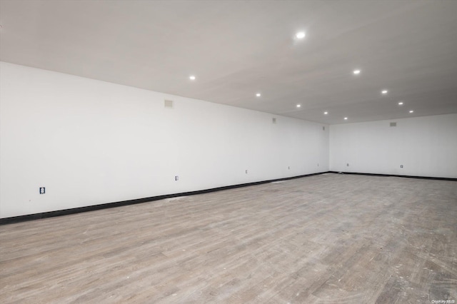 unfurnished room with light hardwood / wood-style flooring