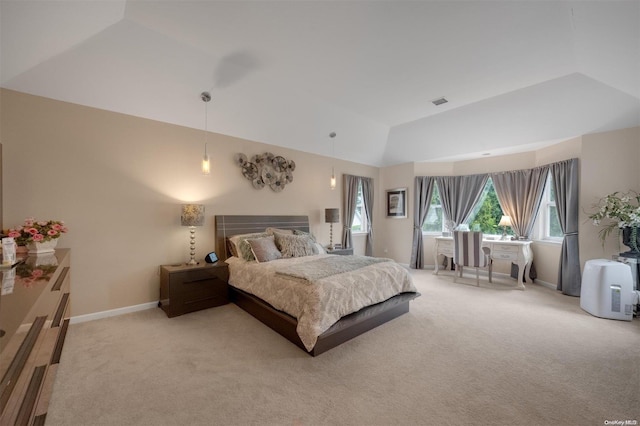 bedroom featuring light colored carpet and vaulted ceiling