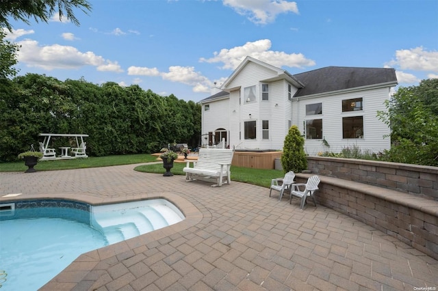 back of property featuring a patio area