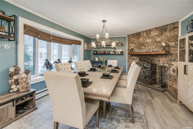 dining area with a wall mounted air conditioner, an inviting chandelier, baseboard heating, hardwood / wood-style flooring, and ornamental molding