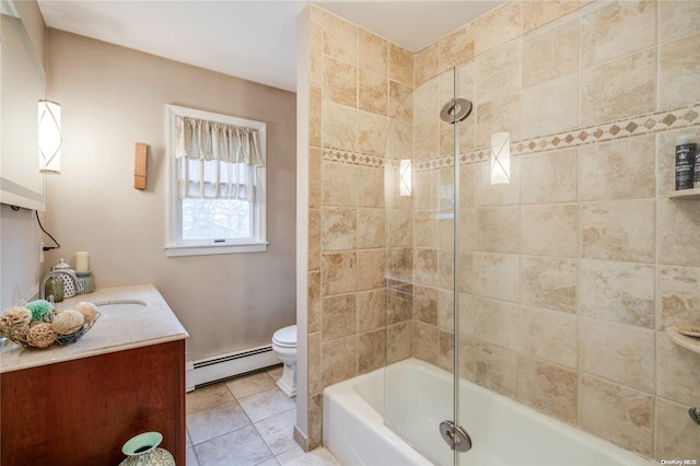 full bathroom featuring vanity, shower / bath combination with glass door, tile patterned floors, toilet, and baseboard heating