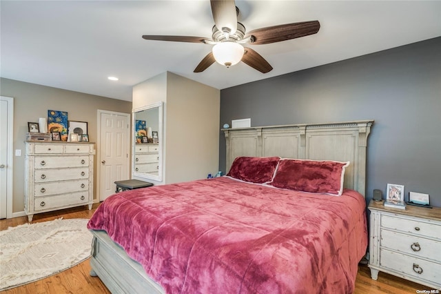 bedroom featuring light hardwood / wood-style flooring and ceiling fan