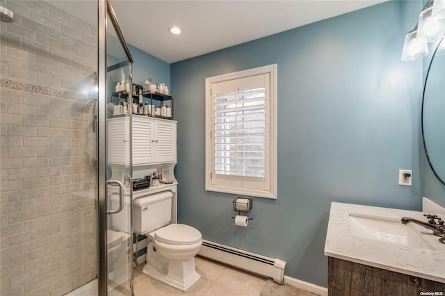 bathroom featuring vanity, a shower with door, baseboard heating, tile patterned flooring, and toilet