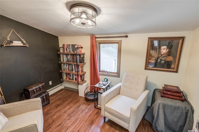 sitting room featuring dark hardwood / wood-style floors and baseboard heating