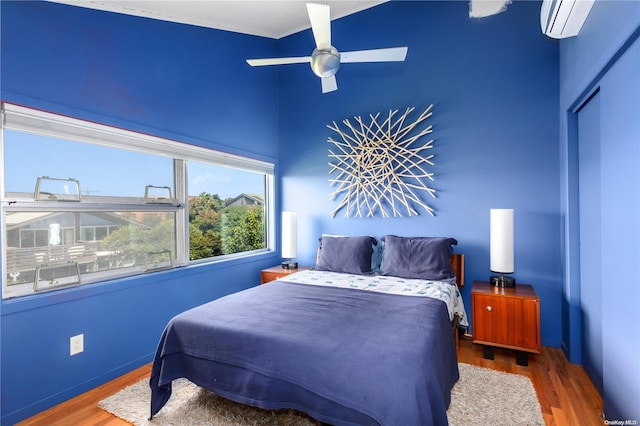 bedroom featuring hardwood / wood-style floors, a closet, and ceiling fan