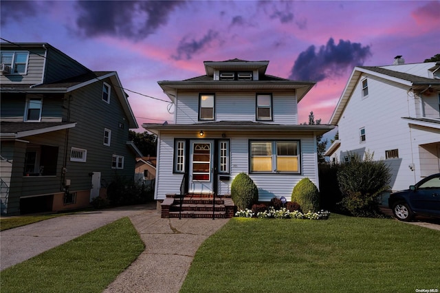 185 Utter Ave, Staten Island, NY 10314 - american foursquare style home with a front yard, entry steps, and driveway