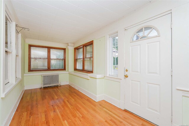 185 Utter Ave, Staten Island, NY 10314 - foyer with radiator, light wood-style floors, and baseboards