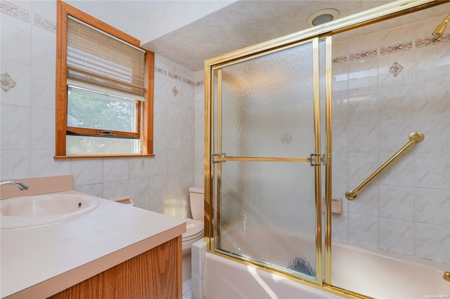 185 Utter Ave, Staten Island, NY 10314 - bathroom with tile walls, shower / bath combination with glass door, vanity, and toilet
