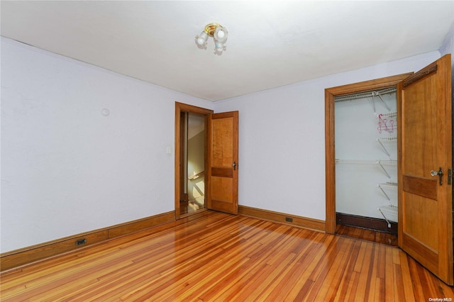 185 Utter Ave, Staten Island, NY 10314 - unfurnished bedroom featuring light wood finished floors, a closet, and baseboards