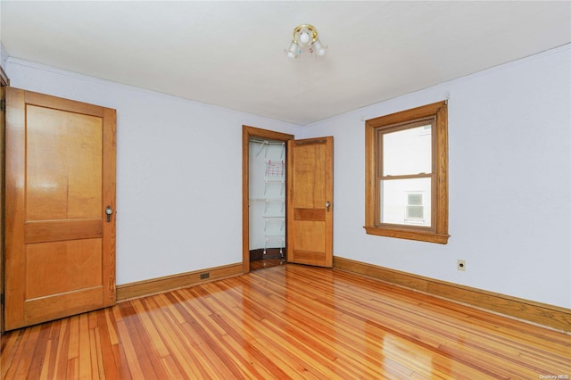 spare room with light wood-type flooring