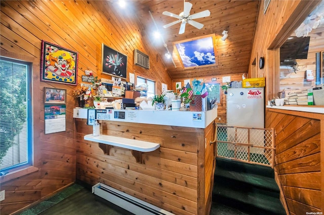 bar featuring a healthy amount of sunlight, lofted ceiling, and wood walls