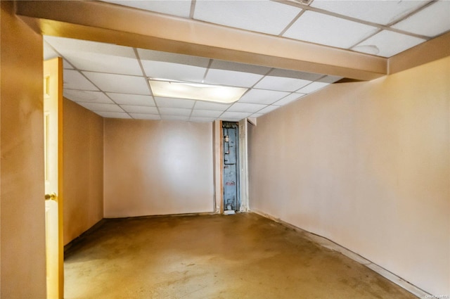 basement featuring a paneled ceiling