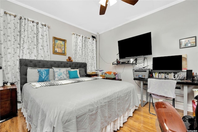 bedroom featuring ceiling fan, light wood-type flooring, and ornamental molding