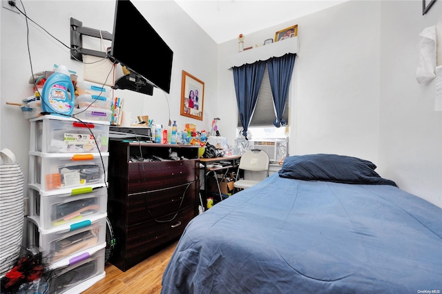 bedroom featuring cooling unit and wood-type flooring