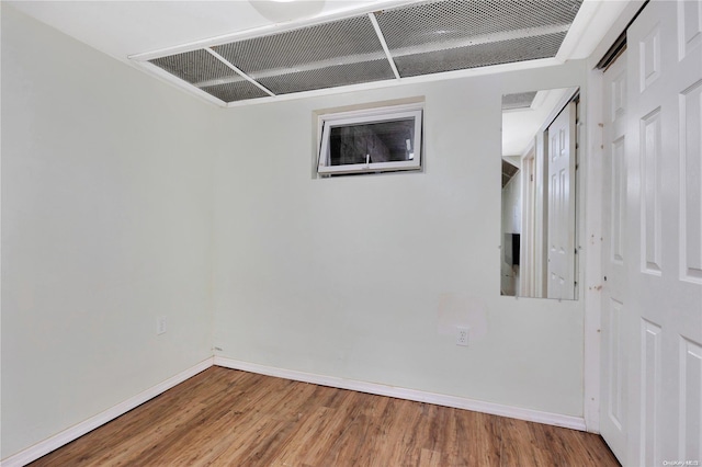 unfurnished room featuring hardwood / wood-style floors