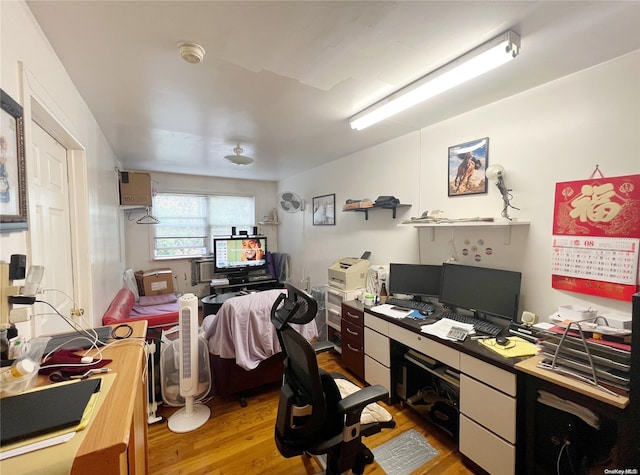 home office with light wood-type flooring