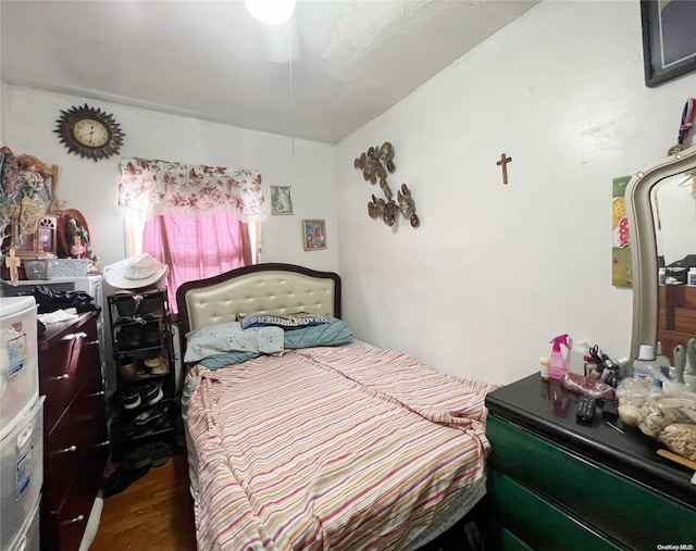 bedroom featuring dark hardwood / wood-style flooring