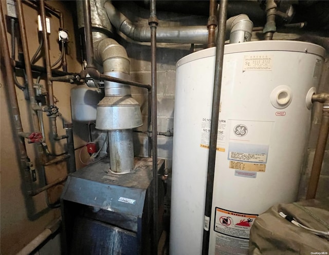 utility room featuring gas water heater