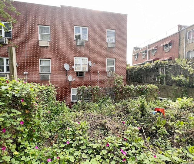 view of building exterior with cooling unit