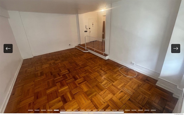 interior space featuring dark parquet floors