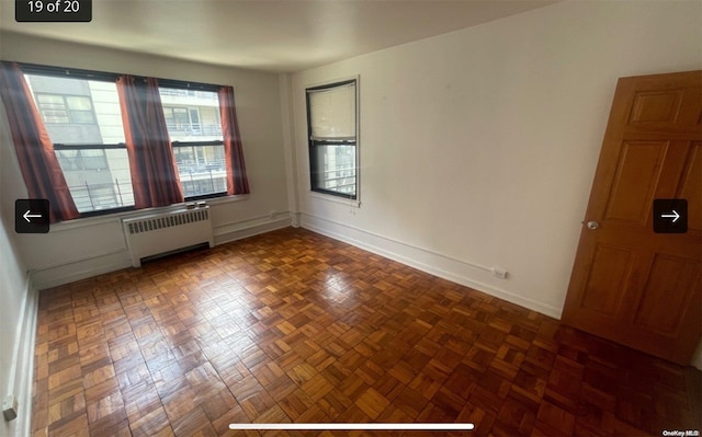 unfurnished room with radiator