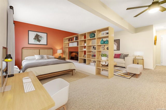 bedroom featuring carpet flooring, ceiling fan, and beam ceiling