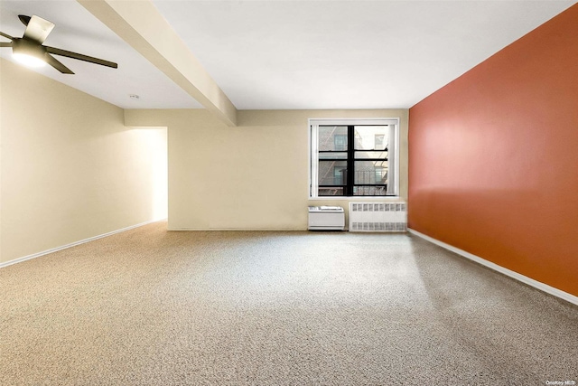 empty room featuring radiator and ceiling fan