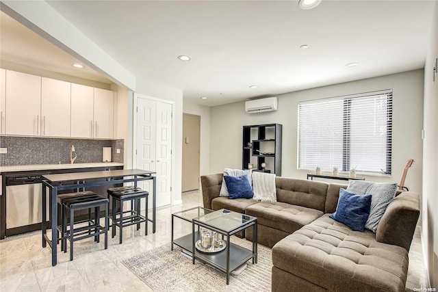 living room featuring an AC wall unit and sink