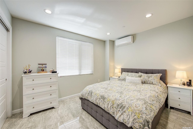 bedroom featuring an AC wall unit