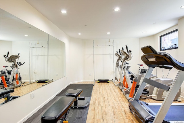 workout area featuring hardwood / wood-style flooring