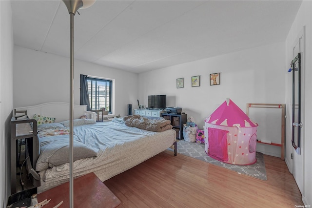 bedroom featuring hardwood / wood-style floors