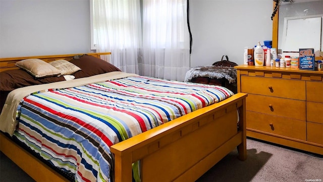 bedroom with light colored carpet