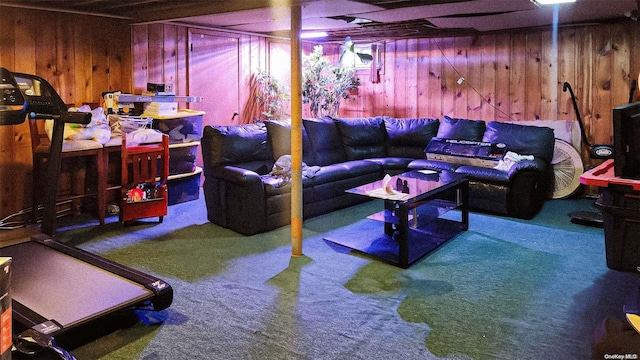 living room featuring carpet floors and wooden walls