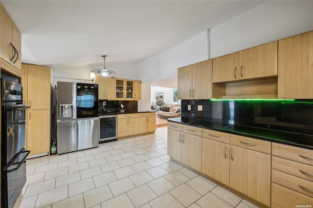 kitchen featuring vaulted ceiling, decorative backsplash, light brown cabinetry, stainless steel fridge with ice dispenser, and beverage cooler