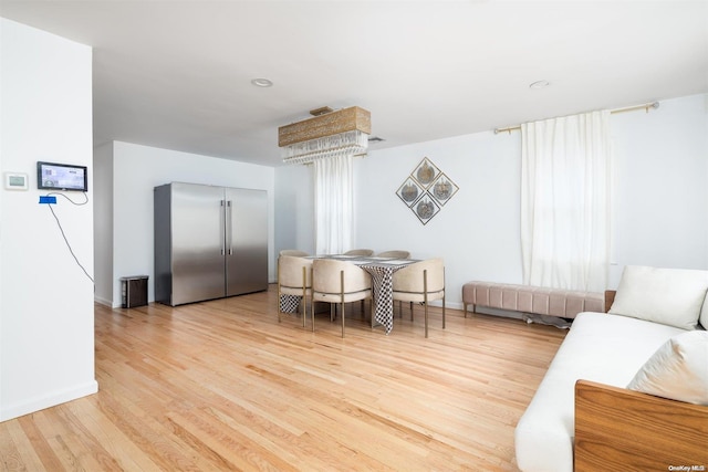 dining space with light wood-type flooring