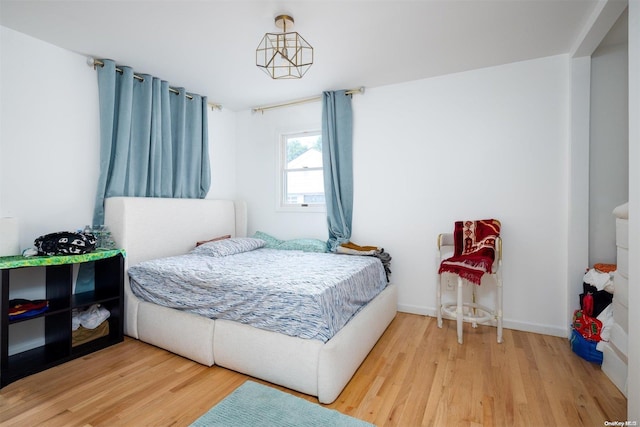 bedroom featuring wood-type flooring