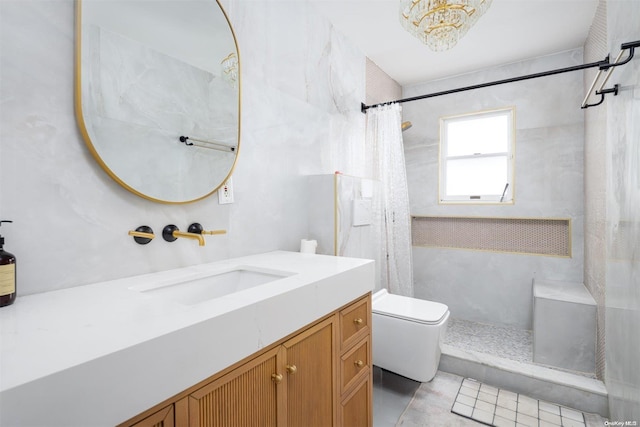 bathroom featuring tile patterned floors, toilet, vanity, and walk in shower