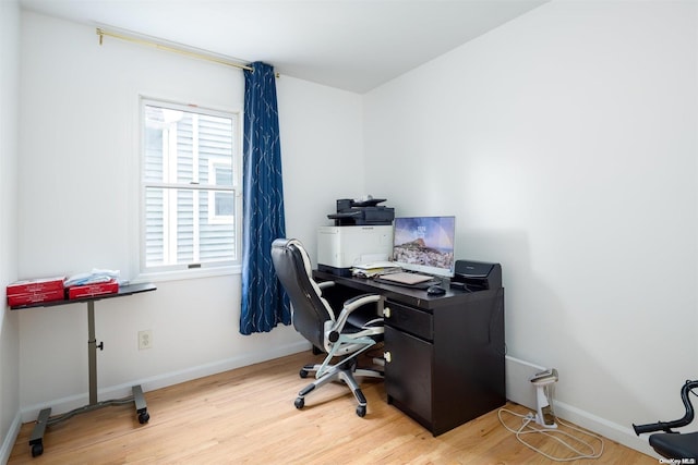 office space with light hardwood / wood-style flooring