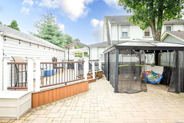 view of patio / terrace with a deck and a gazebo