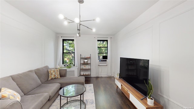 living room featuring dark hardwood / wood-style flooring and a notable chandelier