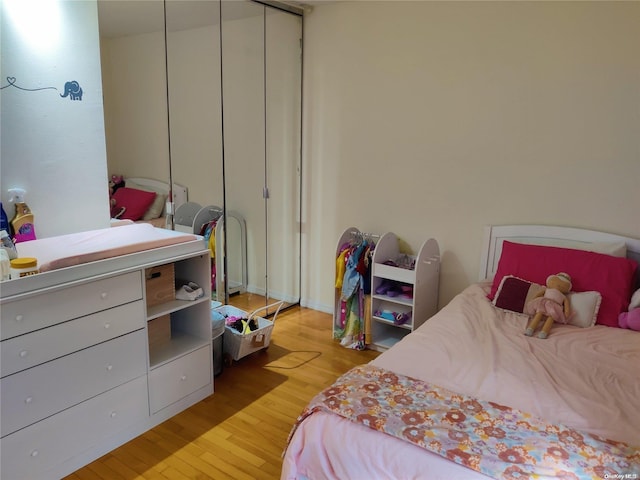 bedroom featuring a closet and light hardwood / wood-style flooring