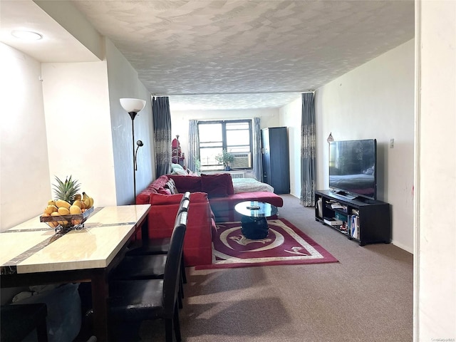 living room featuring carpet, cooling unit, and a textured ceiling