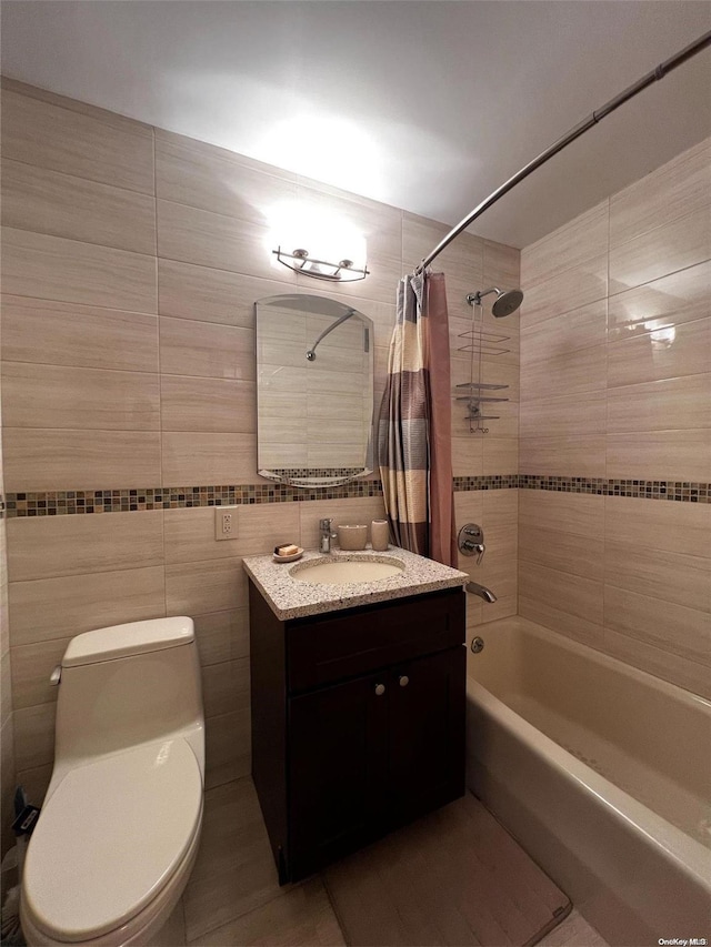 full bathroom featuring vanity, toilet, tile walls, and shower / tub combo with curtain