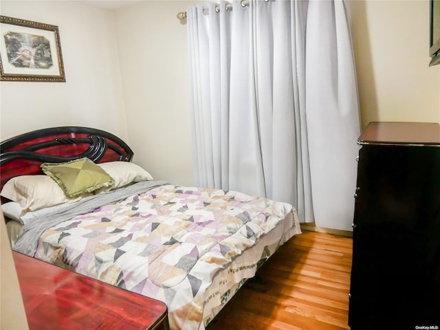 bedroom featuring wood-type flooring