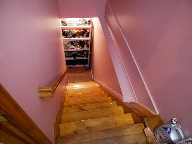 staircase featuring hardwood / wood-style flooring