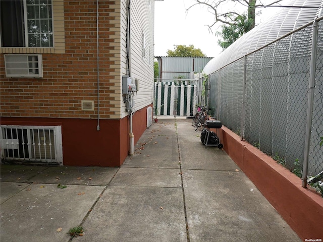 view of property exterior featuring a patio area