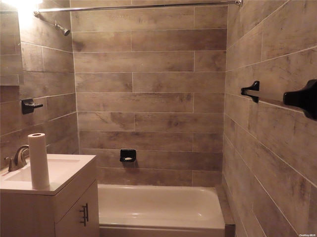 bathroom featuring vanity and tiled shower / bath combo