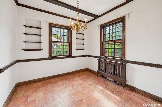 unfurnished room featuring a chandelier, plenty of natural light, and ornamental molding