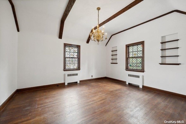 unfurnished living room featuring dark hardwood / wood-style floors, a healthy amount of sunlight, and radiator