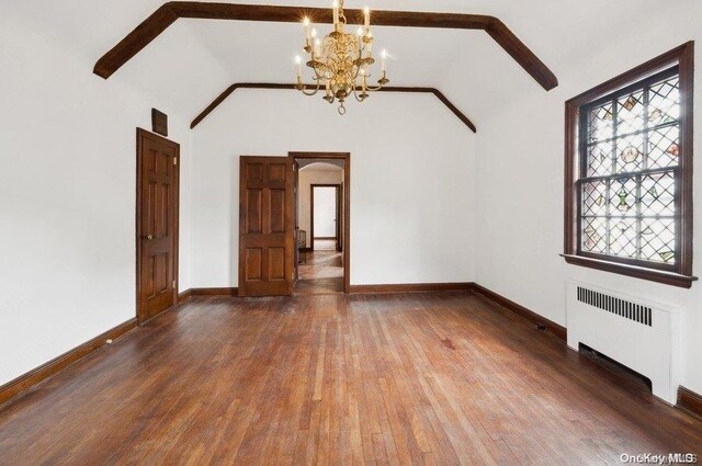 29-37 168th St, Flushing, NY 11358 - unfurnished living room featuring radiator, wood finished floors, arched walkways, a chandelier, and vaulted ceiling